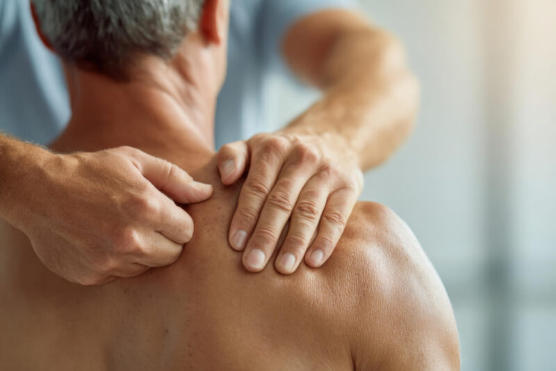 TCM practitioner assessing scapular pain in Nanaimo clinic