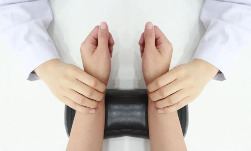 Close-up of Traditional Chinese Medicine pulse diagnosis on wrist - Identifying patterns of liver-stomach disharmony causing heartburn symptoms in SLB tcm acupuncture clinic Nanaimo.